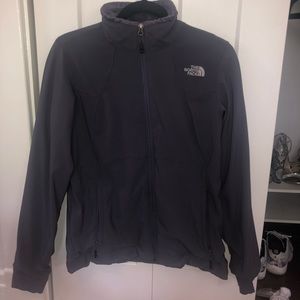 Charcoal grey fleece lined windbreaker jacket.